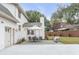Charming patio features an outdoor dining set, comfortable seating, and ample green space at 19 Ponce De Leon Ave, Charleston, SC 29407