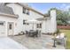 Patio features an outdoor dining set, a stone pathway, and a lush green lawn at 19 Ponce De Leon Ave, Charleston, SC 29407