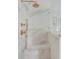 Modern shower featuring marble details and gold hardware at 19 Ponce De Leon Ave, Charleston, SC 29407