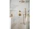 Modern glass shower with marble details and gold fixtures at 19 Ponce De Leon Ave, Charleston, SC 29407