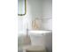 Modern bathroom featuring white tub, marble details, and gold hardware at 19 Ponce De Leon Ave, Charleston, SC 29407