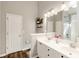 Bathroom with dual vanity, modern fixtures and decorative shelving at 1971 N Smokerise Way, Mount Pleasant, SC 29466