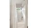 Bright bathroom featuring a white tub-shower combination with tiled walls and sunlight at 1971 N Smokerise Way, Mount Pleasant, SC 29466