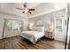 Spacious bedroom with tray ceiling, ceiling fan and plenty of natural light at 1971 N Smokerise Way, Mount Pleasant, SC 29466