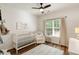 Bedroom with a white crib, ceiling fan, and window at 1971 N Smokerise Way, Mount Pleasant, SC 29466