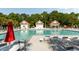 Large community pool with plenty of lounge chairs and shaded areas for relaxation at 1971 N Smokerise Way, Mount Pleasant, SC 29466