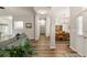 Open-concept hallway leading to dining room and kitchen, showcasing modern flooring at 1971 N Smokerise Way, Mount Pleasant, SC 29466