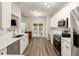 Modern kitchen with white cabinets, stainless appliances, and view to patio at 1971 N Smokerise Way, Mount Pleasant, SC 29466