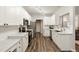 Bright kitchen featuring white cabinets, stainless steel appliances, and modern countertops at 1971 N Smokerise Way, Mount Pleasant, SC 29466