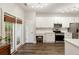 Modern white kitchen with stainless steel appliances, tile backsplash, and bright, natural lighting at 1971 N Smokerise Way, Mount Pleasant, SC 29466