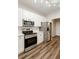 Well-lit kitchen featuring white cabinets and stainless steel appliances at 1971 N Smokerise Way, Mount Pleasant, SC 29466