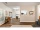 Bright living area with hardwood floors leading to the kitchen and an outdoor patio at 1971 N Smokerise Way, Mount Pleasant, SC 29466