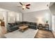 Spacious living room with vaulted ceiling, sectional sofa, decorative rug, and view of the entryway at 1971 N Smokerise Way, Mount Pleasant, SC 29466