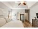 Main bedroom with tray ceilings, and view to bathroom and closet at 1971 N Smokerise Way, Mount Pleasant, SC 29466