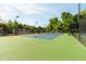 Enjoy a match on the blue and green tennis court surrounded by lush greenery and under the bright, sunny sky at 1971 N Smokerise Way, Mount Pleasant, SC 29466