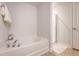 Bathroom with soaking tub and glass-enclosed shower at 2016 Elvington Rd, Johns Island, SC 29455