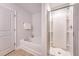 Bright bathroom with soaking tub and glass-enclosed shower at 2016 Elvington Rd, Johns Island, SC 29455