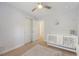Bright Bedroom offers plush carpet, ceiling fan, and a white crib at 2016 Elvington Rd, Johns Island, SC 29455