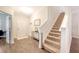 Inviting entryway featuring wood-look flooring, a staircase, and neutral paint colors throughout at 2016 Elvington Rd, Johns Island, SC 29455