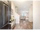 Bright foyer with wood flooring, a decorative table, and an open view to the living room at 2016 Elvington Rd, Johns Island, SC 29455