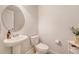 Clean half bathroom features a pedestal sink, neutral paint, and modern fixtures at 2016 Elvington Rd, Johns Island, SC 29455