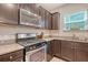Updated kitchen with stainless steel appliances, ample cabinet space, and stylish countertops at 2016 Elvington Rd, Johns Island, SC 29455