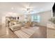 Spacious living room with natural light, a comfortable sectional, and wood-look floors at 2016 Elvington Rd, Johns Island, SC 29455