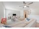 Open living room boasts ceiling fan, plush sofa, and play area at 2016 Elvington Rd, Johns Island, SC 29455