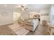 Open-concept living room featuring hardwood floors, neutral paint, and access to the kitchen at 2016 Elvington Rd, Johns Island, SC 29455