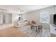 Open living room features large windows, plush carpet, and ceiling fan at 2016 Elvington Rd, Johns Island, SC 29455