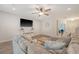 Comfortable living room featuring a plush sectional sofa and a modern ceiling fan at 2016 Elvington Rd, Johns Island, SC 29455