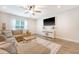 Comfortable living room featuring a ceiling fan, natural light, and modern decor at 2016 Elvington Rd, Johns Island, SC 29455