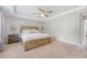 Spacious primary bedroom with tray ceilings, ceiling fan, and carpet flooring at 2016 Elvington Rd, Johns Island, SC 29455