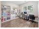 Functional home office with built-in shelving, a large window, and ample workspace at 2016 Elvington Rd, Johns Island, SC 29455