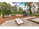 Fenced playground area with various play structures and a cornhole game for Gathering fun at 2016 Elvington Rd, Johns Island, SC 29455