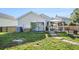 Backyard with outdoor living and dining setup next to home at 203 Eagle Ridge Rd, Summerville, SC 29485