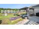 Backyard with covered gazebo, furniture, and lake view surrounded by manicured lawn at 203 Eagle Ridge Rd, Summerville, SC 29485