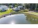 Backyard view with a cozy gazebo and a fenced yard by the lakefront for serene outdoor enjoyment at 203 Eagle Ridge Rd, Summerville, SC 29485