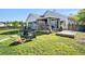 Landscaped backyard features a gazebo and comfortable furniture for outdoor entertaining at 203 Eagle Ridge Rd, Summerville, SC 29485