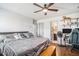 Inviting bedroom with a ceiling fan, wood floors, and a view of the ensuite bathroom at 203 Eagle Ridge Rd, Summerville, SC 29485
