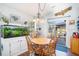 Cozy dining area with a round table, backyard view, and stylish decor at 203 Eagle Ridge Rd, Summerville, SC 29485