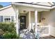 Inviting front porch with decorative accents, plants, and a charming welcome area at 203 Eagle Ridge Rd, Summerville, SC 29485