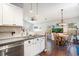 Open concept kitchen with a view to the dining area with updated appliances and subway tile backsplash at 203 Eagle Ridge Rd, Summerville, SC 29485