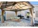 Back patio with beautiful stone pavers, covered gazebo with outdoor furniture and grill at 203 Eagle Ridge Rd, Summerville, SC 29485