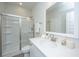 Clean bathroom featuring a glass-enclosed shower, modern sink with white countertops, and neutral color scheme at 203 O'Malley Dr, Summerville, SC 29483