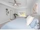Large main bedroom featuring a tray ceiling, a ceiling fan, and light-filled windows with backyard views at 203 O'Malley Dr, Summerville, SC 29483
