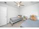 Charming ' bedroom featuring twin beds, soft grey linens, a ceiling fan, and carpet flooring at 203 O'Malley Dr, Summerville, SC 29483