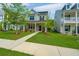 Charming two-story home with a well-manicured lawn, trees, and a sidewalk leading to the front door at 203 O'Malley Dr, Summerville, SC 29483