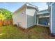 Side view of home showing green backyard and patio, complete with fenced yard for privacy at 203 O'Malley Dr, Summerville, SC 29483