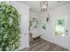 Bright foyer with modern decor, light wood floors, a bench, and a stylish light fixture at 203 O'Malley Dr, Summerville, SC 29483